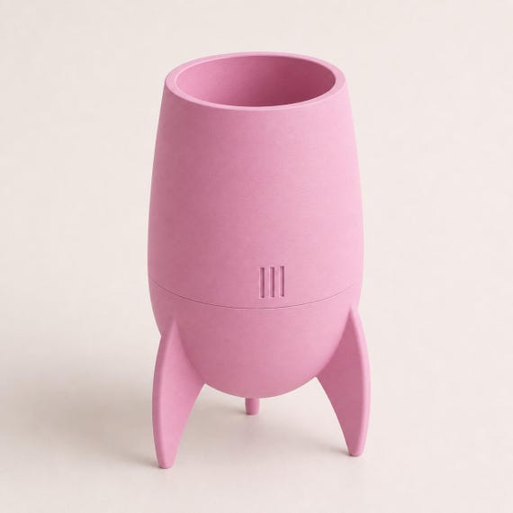 Close-up elevated view of the Orbitcrest indoor planter in Sakura Pink