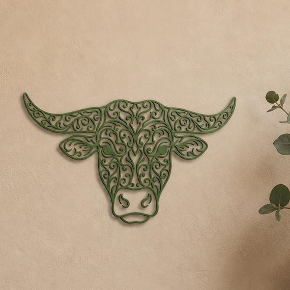Close-up of Cow Portrait filigree wall art in Green in a contrasting room