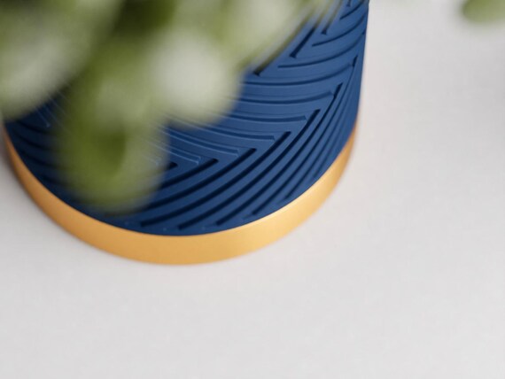 Close-up detail of the Marine Blue matte body and Silk Gold base in the Ocean Crown colorway