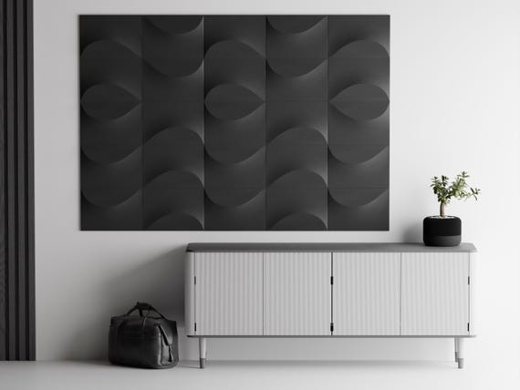 Close-up charcoal TideFold relief tile arrangement mounted above a modern console