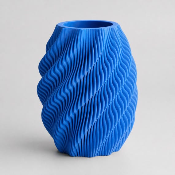Quietflow ribbed flower vase in Cobalt Blue from a three-quarter view