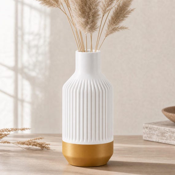 Close-up of the Stillcrest ribbed vase in the White and Gold Gilded White colorway