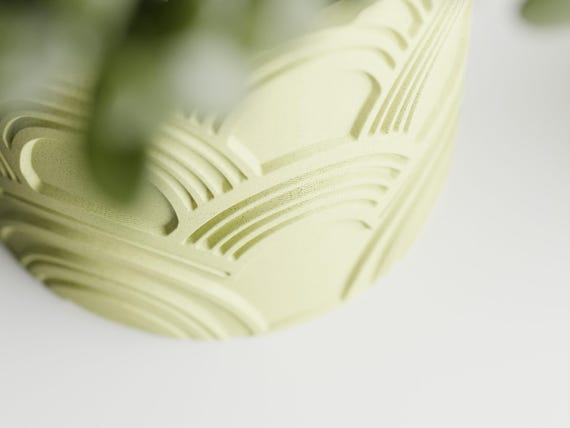 Macro detail of the recessed fan-shaped channels on an ArcEcho planter