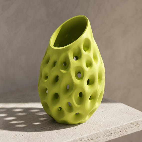 Close-up of the empty Lacuna Bloom organic vase in Bright Green showing its slanted opening