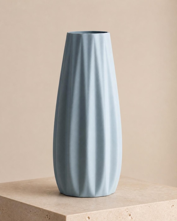 Rear three-quarter close-up of an empty Ice Blue Loomrise ribbed vase