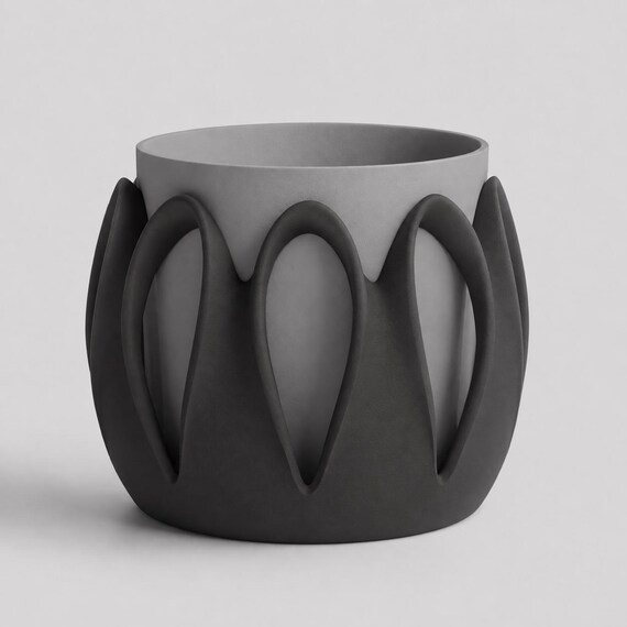 Close-up of the Arcloom planter in Midnight, with Charcoal arches framing an Ash Gray inner pot on a pale gray background.