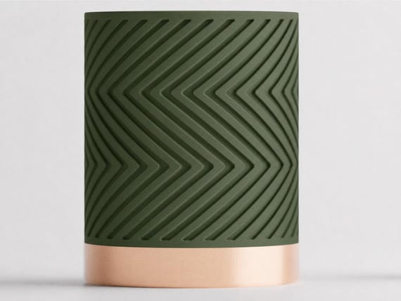 Straight-on close-up of the Dark Green matte pot and Silk Champagne base in Verdant Glow