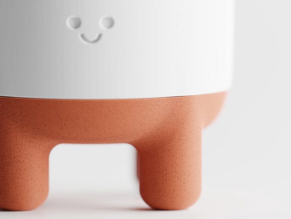 Detail close-up of the CheerPod smiling face and Terracotta rounded lower feet