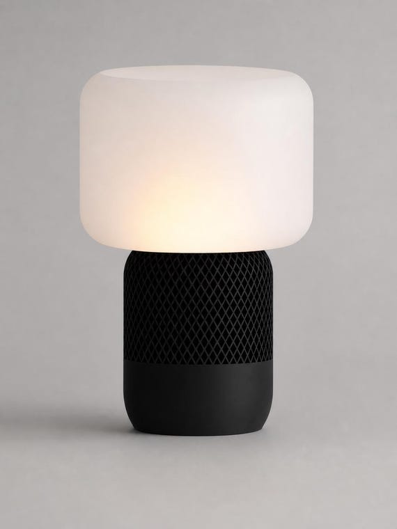 Close detail of Black diamond lattice base meeting the smooth White shade on the MeshGlow lamp