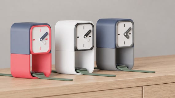 Keephour Watch Stand Clock colorful examples from an alternate source angle on oak, with watches with green bands in the lower spaces.