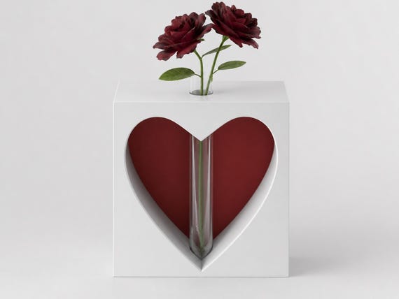 Close detail of the beveled heart opening, red backdrop, and centered clear tube in the Keepsake vase