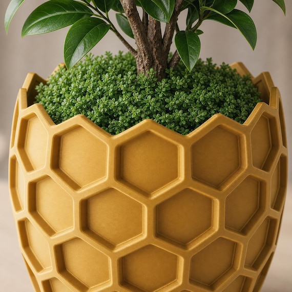 Macro close-up of the Gold HexaGrove planter showing its recessed hexagons and crown rim