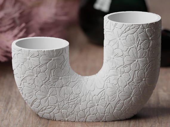 Close-up front view of the Garden Blossoms BloomArc twin vase showing two circular stem wells