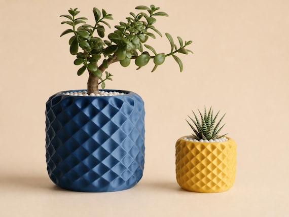 Large Cobalt Blue and small Sunflower Yellow FacetNest planters shown together for scale