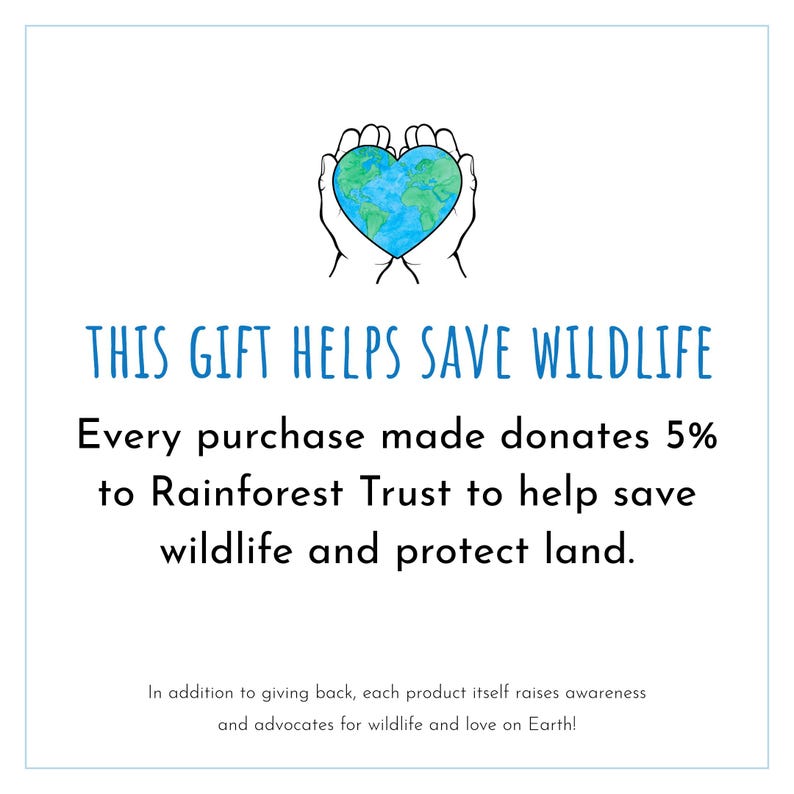 May include: A white background with the text "THIS GIFT HELPS SAVE WILDLIFE." The image includes a drawing of two hands cupping a heart-shaped globe. The text states that every purchase donates 5% to the Rainforest Trust.