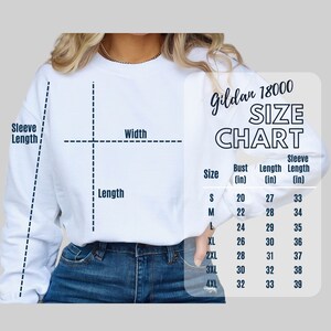 May include: A white Gildan 18000 sweatshirt size chart featuring a diagram with dashed lines indicating width, length, and sleeve length. A table lists sizes S through 4XL with corresponding bust, length, and sleeve length measurements in inches.