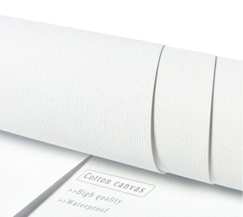 May include: Close-up of a white cotton canvas roll. The text "Cotton canvas", "High quality", and "Waterproof" is printed on a white label.