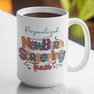 May include: White ceramic mug with a colourful design that says "Personalized Newborn Screening Team". The design features a patchwork pattern with baby icons and the words in a teal blue font.