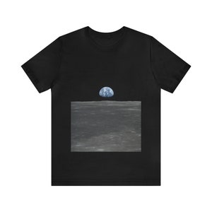 May include: A black t-shirt with a graphic of the Earth rising over the moon's surface.