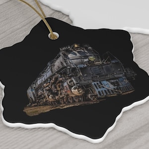 May include: A black and silver steam locomotive with the number "4014" on the side. The locomotive is in focus and the background is blurred.