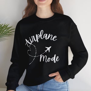 May include: Black sweatshirt with white text that reads "Airplane Mode" with a stylised airplane and heart graphic.