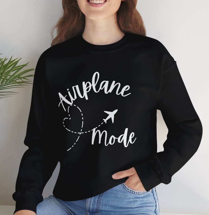 May include: Black sweatshirt with white text that reads "Airplane Mode" with a stylised airplane and heart graphic.
