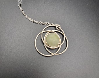 Serpentine encircled in sterling silver pendant on cable chain