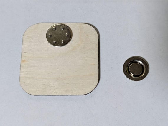 Back of the birch kids convention badge showing its detachable poke-free magnetic lapel attachment