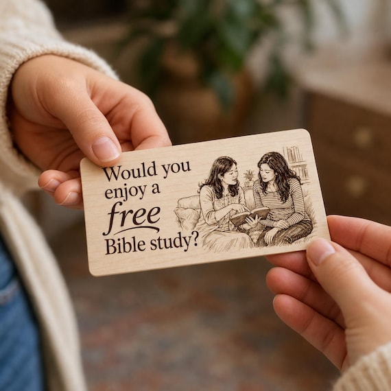 Open Page Bible Study Contact Card being passed between two people in a close-up indoor scene.