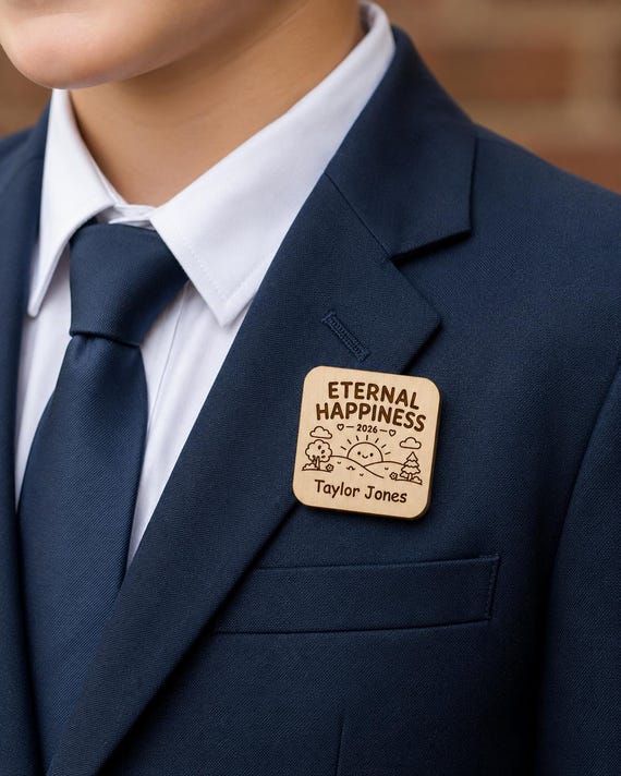 Child wearing a personalized 2026 Eternal Happiness birch convention badge on a navy jacket