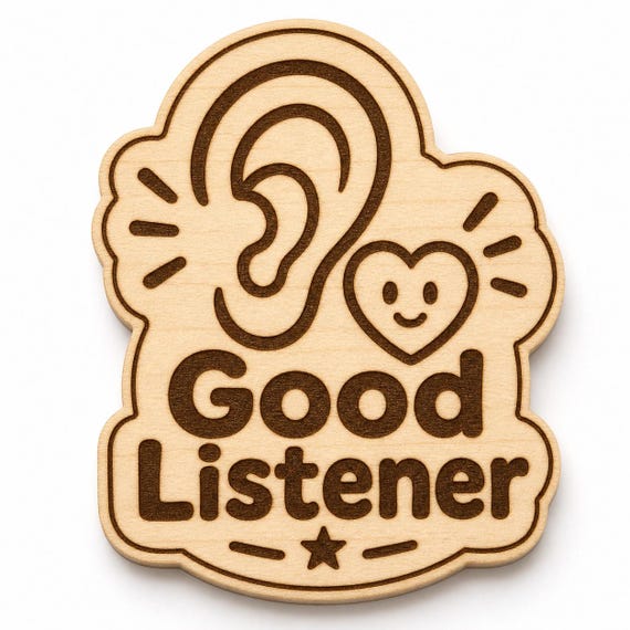 Listening Heart engraved birch reward badge with Good Listener artwork shown close up on white.