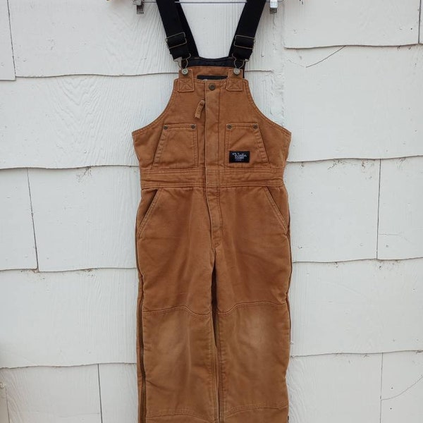OmniaOmnibusUSA • #2 - Vintage Distressed Faded Walls Blizzard Pruf Insulated Beige Tan Overalls | Youth | Grungy Stained Well Worn | USA