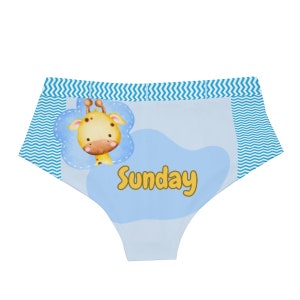 May include: Light blue underwear with a giraffe illustration and the word "Sunday" in yellow. The underwear has a blue zigzag pattern along the top and sides, and a light blue background.
