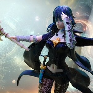 May include: A detailed figurine of a female character in a black outfit with a cape, intricate lace leggings, and a small dagger. The figure has blue hair and is posed on a rocky base against a fantasy background.