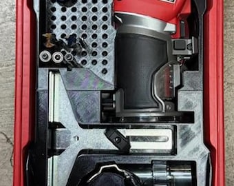 May include: A red and black Milwaukee Compact Router tool kit. The kit contains a router, various bits, and accessories, all neatly arranged within a red case. The tools are designed for woodworking and other precision tasks.