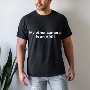 May include: A black t-shirt with white text that reads "My other camera is an ARRI".