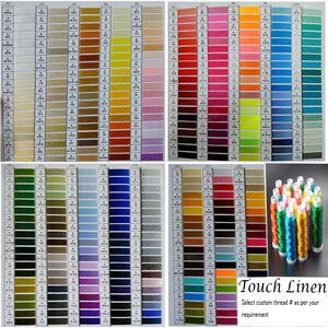 May include: A comprehensive colour chart of embroidery thread spools, displaying a wide array of shades. The image features a variety of thread colours, from vibrant reds and blues to softer pastels. The text "Touch Linen" and a call to action are also visible.
