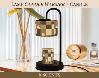 May include: A black candle warmer lamp with a geometric patterned shade and candle. The lamp has a curved arm and a round base. The image also includes a gold clock, a glass vase with flowers, and the text "6 SCENTS".