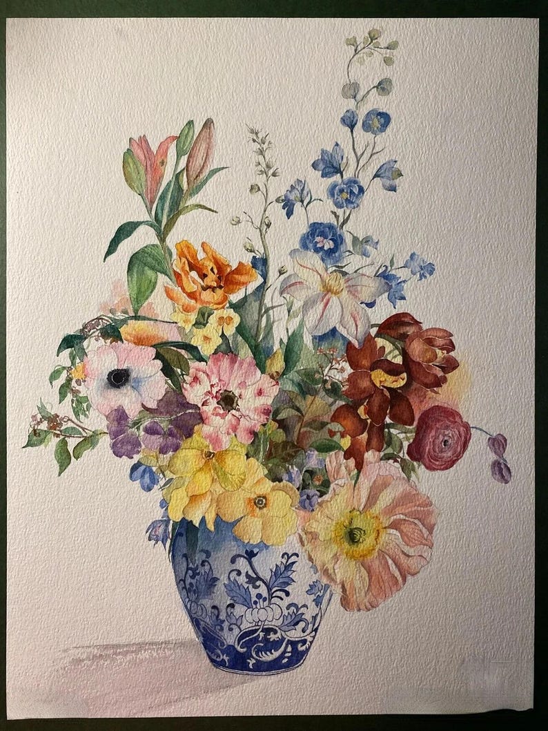 May include: Watercolor painting of a vibrant floral arrangement in a blue and white patterned vase. The bouquet features a variety of flowers in shades of pink, yellow, orange, purple, and blue. The artwork is set against a white background.