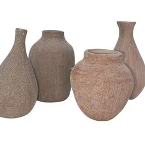 May include: Four neutral-toned ceramic vases of varying shapes. The vases have a textured surface and a matte finish. The shapes include a teardrop, a rounded bottle, and two vases with a narrow neck. The vases are suitable for home decor.