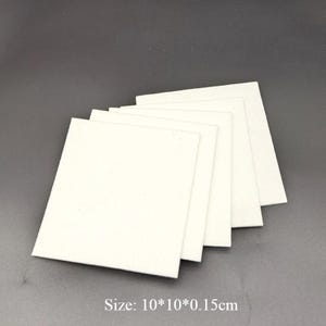 May include: Five white square pieces of foam, each measuring 10 inches by 10 inches by 0.15 inches.  Size: 10*10*0.15cm