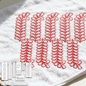 May include: White towel with red embroidered leaf-like design. The design is repeated across the towel. Several smaller embroidery pattern examples are shown below the towel's design. The towel is made of a soft, absorbent material.