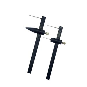 May include: Two black circle drawing tools with adjustable needles and rulers. The tools are used for drawing circles of different sizes.