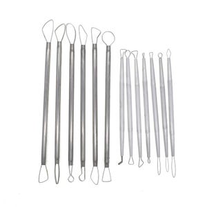 May include: A set of silver metal sculpting tools with diverse tip shapes, such as loops, blades, and angled edges. The tools are displayed against a white backdrop, highlighting their varied forms and sizes, suitable for intricate tasks.
