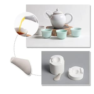 May include: A white ceramic teapot with a lid, a handle, and a spout, sits on a wooden surface. Three small, light blue teacups are arranged in front of the teapot. A close-up shows tea being poured into a teacup. Additional ceramic molds are also shown.