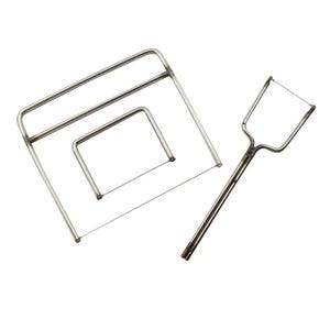 May include: A set of three silver-toned metal wire cutters for clay or food, featuring two rectangular frames with thin horizontal wires and one handheld tool with a U-shaped head and a single thin wire stretched across the opening.