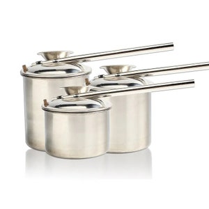 May include: Set of three stainless steel pots with long handles. The pots are nested inside each other, with the largest pot at the bottom and the smallest pot at the top.