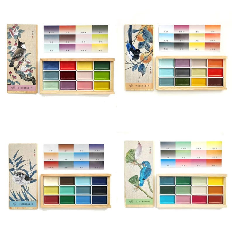 May include: Watercolor paint sets with wooden boxes and color charts. Each set includes a rectangular wooden box with 12 watercolor paints, a color chart, and a decorative card with a bird illustration. The color palettes vary, offering a range of hues.