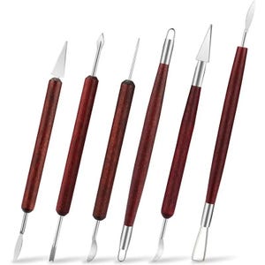 May include: Set of seven red-handled sculpting tools with various metal tips. The tools are used for shaping and detailing clay, polymer clay, and other crafting materials.