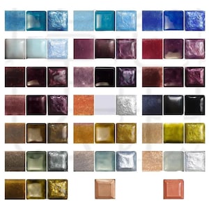 May include: A collection of square mosaic tiles arranged in a grid, featuring a diverse palette of colours including shades of blue, purple, red, black, gold, silver, and copper, with varying finishes ranging from smooth and glossy to textured.